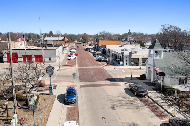 206 Walnut St, Cherry Valley, IL 61016 - view of concrete road featuring sidewalks, street lights, and curbs