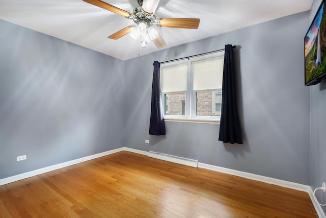 17708 Walter St, Lansing, IL 60438 - unfurnished room with a baseboard radiator, baseboards, a ceiling fan, and wood finished floors
