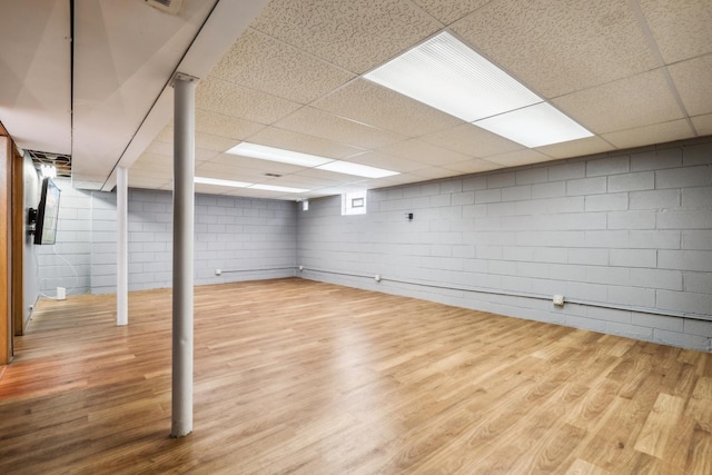 17708 Walter St, Lansing, IL 60438 - below grade area with wood finished floors, a paneled ceiling, and concrete block wall