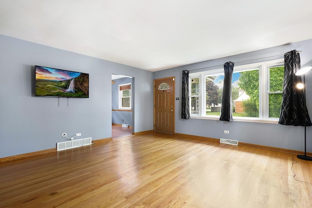17708 Walter St, Lansing, IL 60438 - unfurnished living room with wood finished floors and baseboards