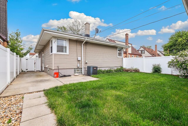 17708 Walter St, Lansing, IL 60438 - rear view of house featuring a patio area, a chimney, central air condition unit, and a gate