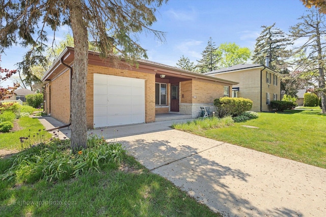 5049 Birchwood Ave, Skokie, IL 60077 - view of front of home featuring brick siding, an attached garage, a front lawn, and driveway