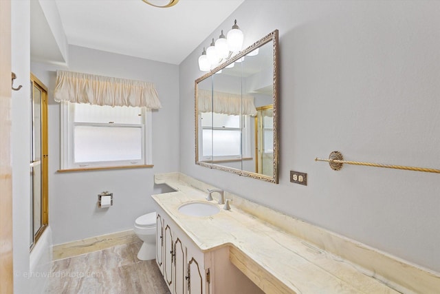 5049 Birchwood Ave, Skokie, IL 60077 - full bath with vanity, toilet, bath / shower combo with glass door, and baseboards