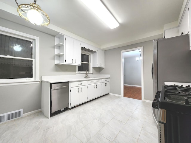 5049 Birchwood Ave, Skokie, IL 60077 - kitchen featuring appliances with stainless steel finishes, a sink, light countertops, open shelves, and white cabinetry