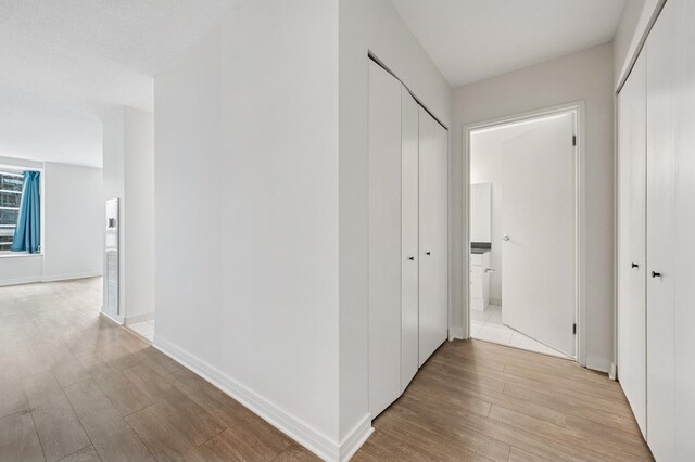 512 N Mcclurg Ct Unit 902, Chicago, IL 60611 - corridor featuring light wood-type flooring and baseboards
