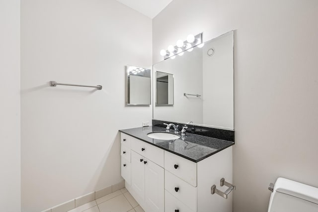 512 N Mcclurg Ct Unit 902, Chicago, IL 60611 - bathroom featuring toilet, vanity, tile patterned flooring, and baseboards