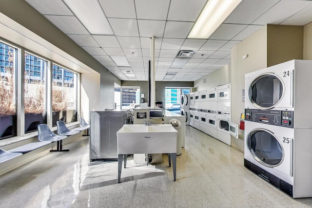 512 N Mcclurg Ct Unit 902, Chicago, IL 60611 - dining space with stacked washer and clothes dryer, washer and dryer, a drop ceiling, and light flooring