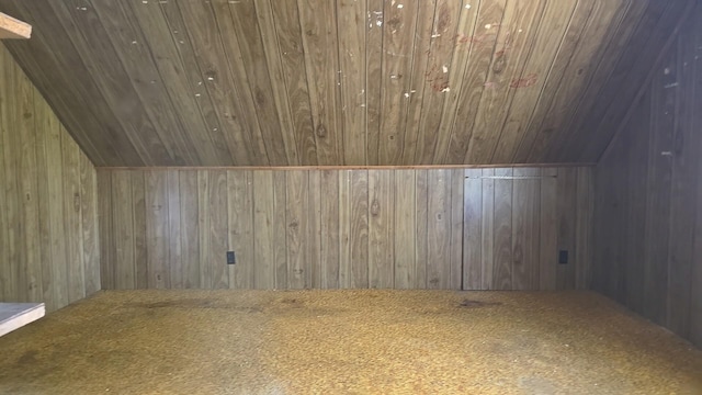 additional living space featuring carpet, wooden walls, lofted ceiling, and wood ceiling