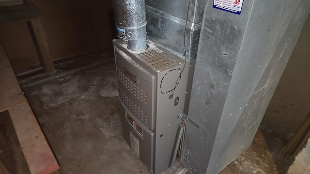 utility room with heating unit