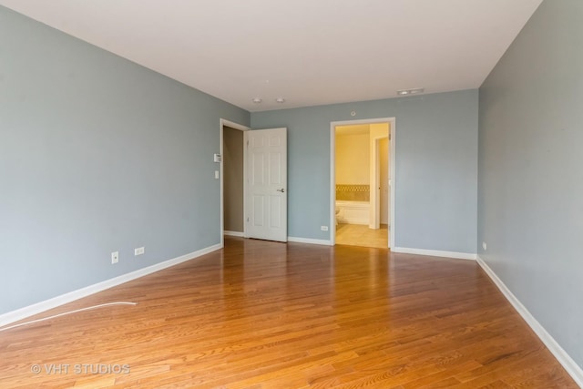 19 Tall Grass Ct, Streamwood, IL 60107 - spare room featuring baseboards and light wood-type flooring