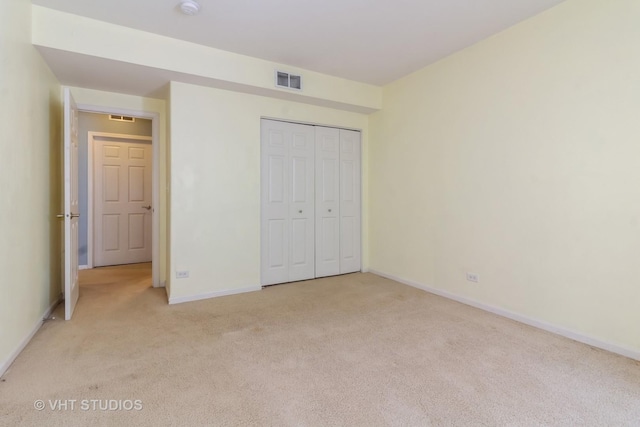 19 Tall Grass Ct, Streamwood, IL 60107 - unfurnished bedroom featuring light carpet, baseboards, and a closet
