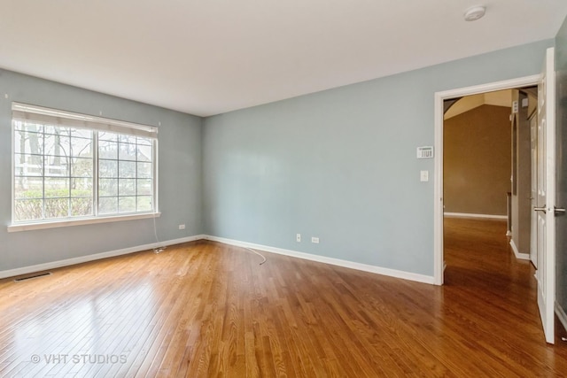 19 Tall Grass Ct, Streamwood, IL 60107 - unfurnished room featuring wood finished floors, a smoke detector, and baseboards