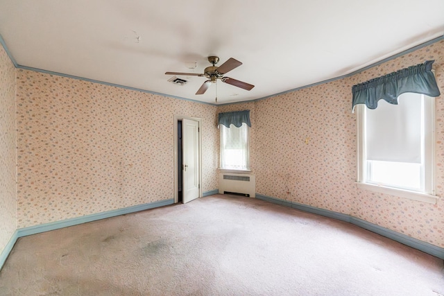 1753 N Normandy Ave, Chicago, IL 60707 - spare room featuring light carpet, a ceiling fan, radiator heating unit, baseboards, and wallpapered walls