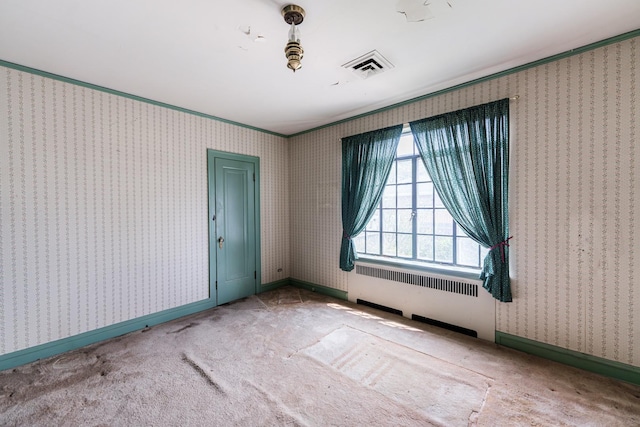 1753 N Normandy Ave, Chicago, IL 60707 - carpeted empty room with radiator heating unit and wallpapered walls