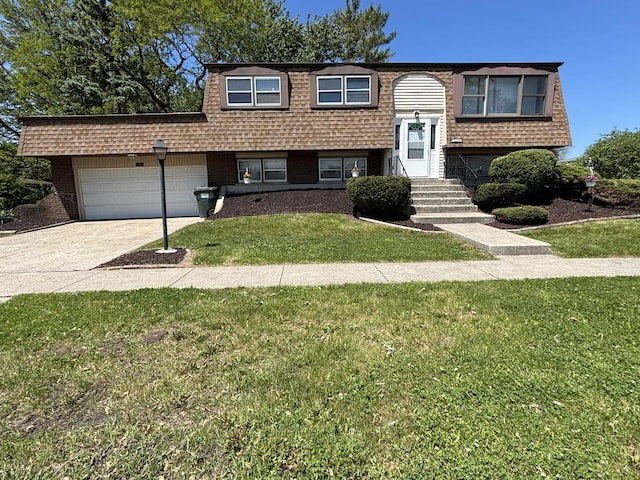 20084 Brook Ave, Lynwood, IL 60411 - split foyer home with a garage, a front lawn, concrete driveway, brick siding, and entry steps