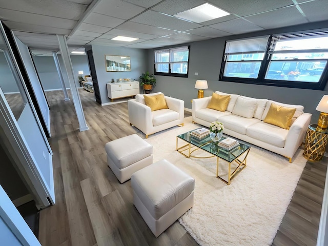 20084 Brook Ave, Lynwood, IL 60411 - living area featuring wood finished floors, a drop ceiling, and baseboards