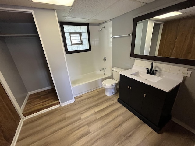 20084 Brook Ave, Lynwood, IL 60411 - full bath featuring wood finished floors, toilet, shower / bathtub combination, vanity, and a drop ceiling