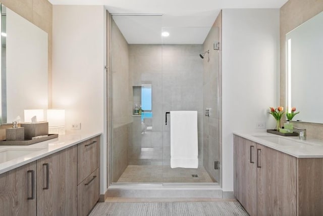211 N Harbor Dr Unit 2208, Chicago, IL 60601 - bathroom featuring a shower stall, two vanities, and recessed lighting