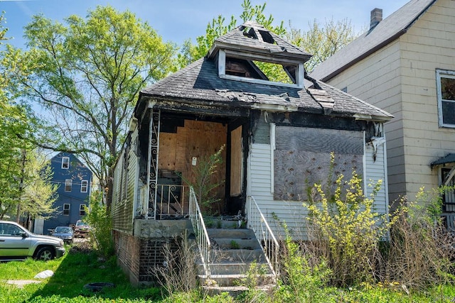 8215 S Coles Ave, Chicago, IL 60617 - view of front of house with a shingled roof