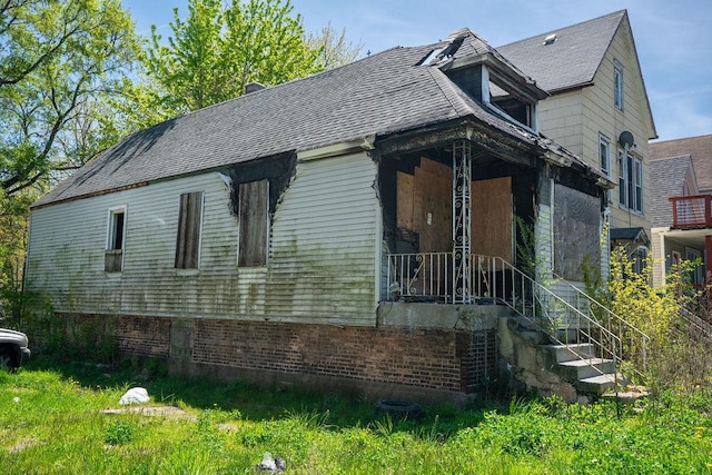 8215 S Coles Ave, Chicago, IL 60617 - view of front of property with brick siding and roof with shingles