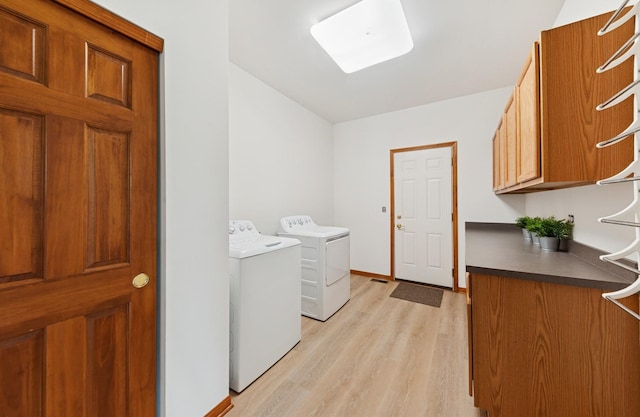 2739 Moraine Valley Rd, Wauconda, IL 60084 - laundry room featuring cabinet space, washer and dryer, light wood-type flooring, and baseboards