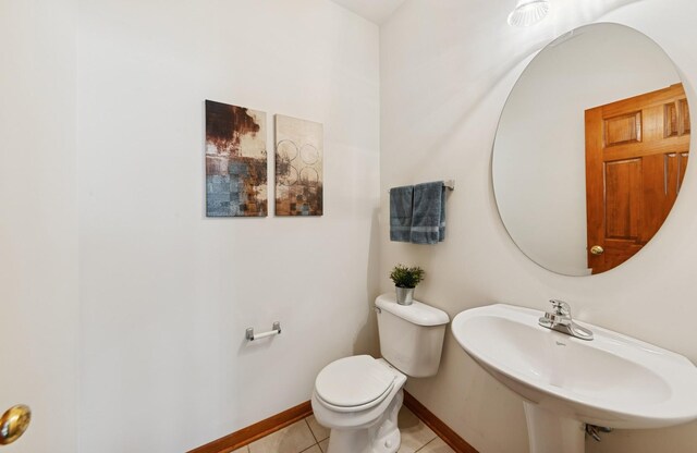 2739 Moraine Valley Rd, Wauconda, IL 60084 - bathroom with a sink, toilet, tile patterned flooring, and baseboards
