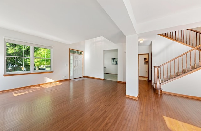 2739 Moraine Valley Rd, Wauconda, IL 60084 - unfurnished living room featuring stairway, wood-type flooring, and baseboards