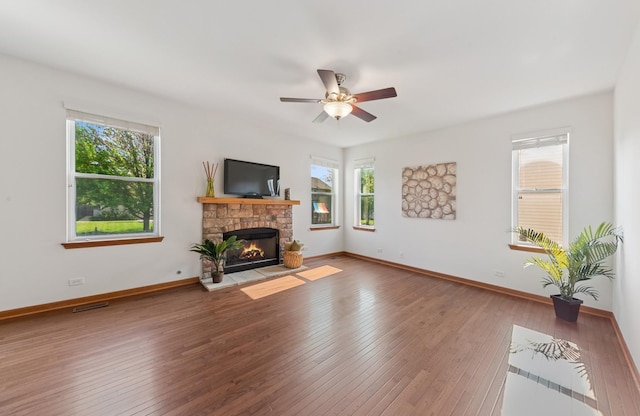 2739 Moraine Valley Rd, Wauconda, IL 60084 - unfurnished living room with healthy amount of natural light, hardwood / wood-style floors, a fireplace, and baseboards