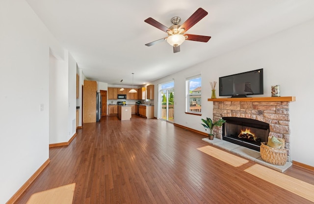 2739 Moraine Valley Rd, Wauconda, IL 60084 - unfurnished living room with baseboards, a fireplace, and dark wood-style flooring