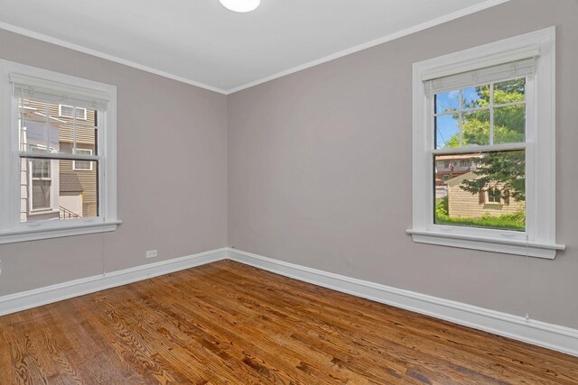 11025 S Millard Ave, Chicago, IL 60655 - empty room featuring wood finished floors, baseboards, healthy amount of natural light, and ornamental molding