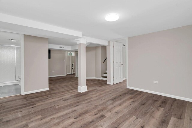 11025 S Millard Ave, Chicago, IL 60655 - finished below grade area with baseboards, wood finished floors, and stairs
