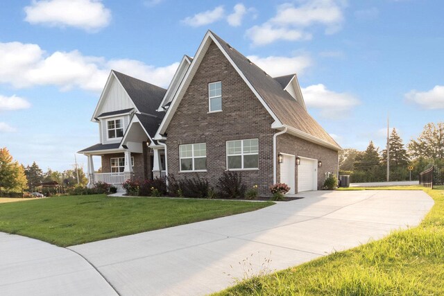 12744 Caruso Ct, Lemont, IL 60439 - view of front of home featuring driveway, brick siding, a front yard, and a porch