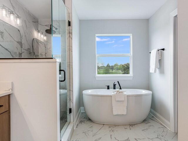 12744 Caruso Ct, Lemont, IL 60439 - bathroom with marble finish floors, a stall shower, baseboards, a freestanding tub, and vanity