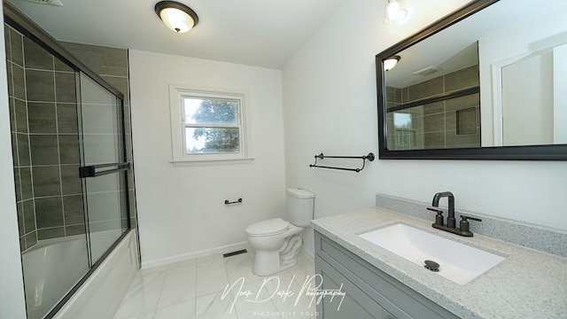 full bathroom with toilet, vanity, shower / bath combination with glass door, and baseboards