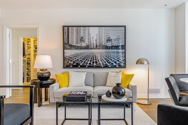 living area featuring wood finished floors and baseboards