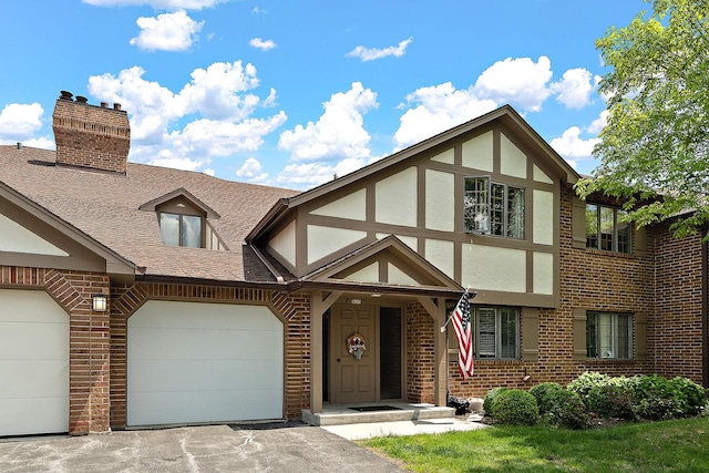 13151 S Westview Dr Unit 1B, Palos Heights, IL 60463 - tudor house featuring brick siding, driveway, roof with shingles, a garage, and stucco siding