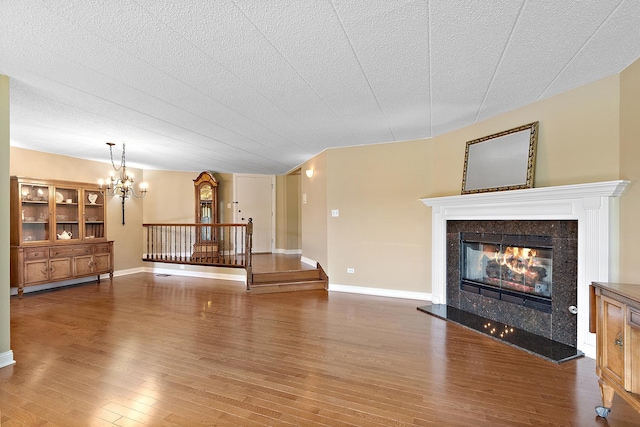 13151 S Westview Dr Unit 1B, Palos Heights, IL 60463 - unfurnished living room with a tile fireplace, wood finished floors, and baseboards