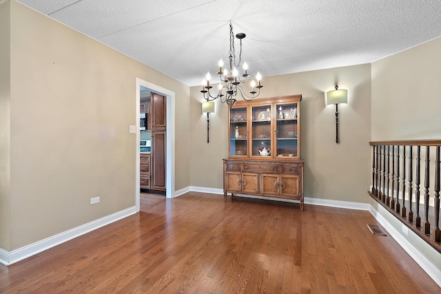 13151 S Westview Dr Unit 1B, Palos Heights, IL 60463 - dining space with a chandelier, dark wood finished floors, and baseboards