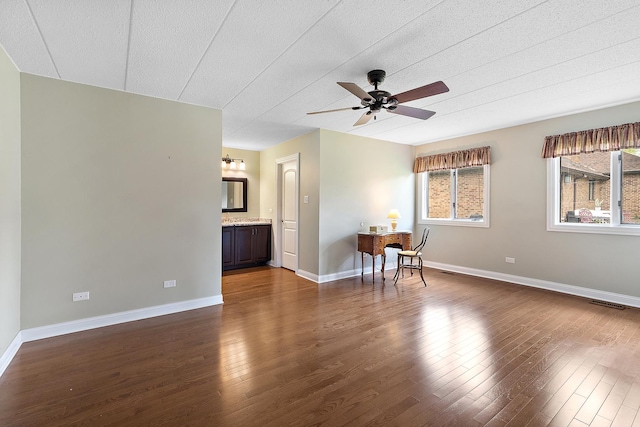 13151 S Westview Dr Unit 1B, Palos Heights, IL 60463 - spare room featuring dark wood finished floors, a ceiling fan, and baseboards
