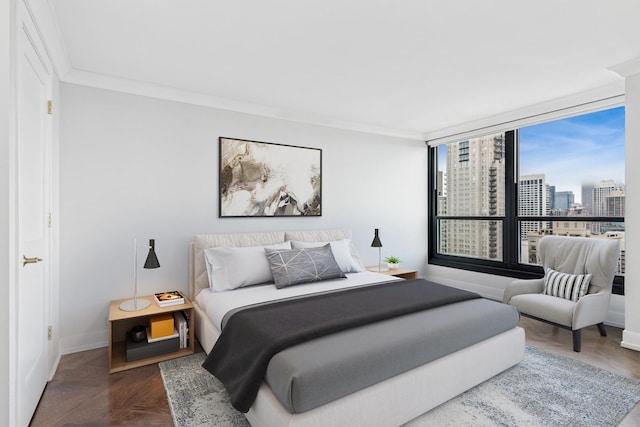 1030 N State St Unit 42L, Chicago, IL 60610 - bedroom with a city view, baseboards, and ornamental molding