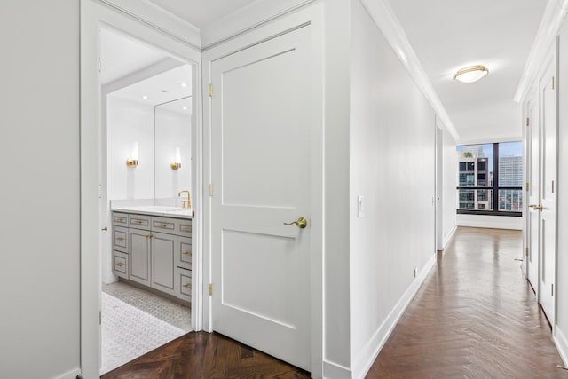 1030 N State St Unit 42L, Chicago, IL 60610 - hallway with ornamental molding, baseboards, and a sink