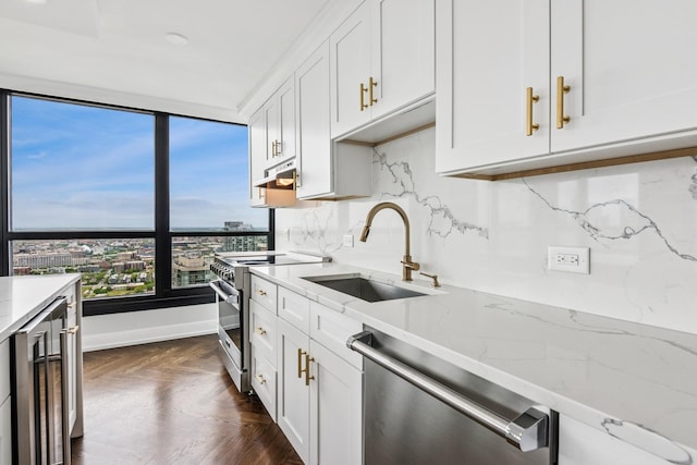 1030 N State St Unit 42L, Chicago, IL 60610 - kitchen featuring appliances with stainless steel finishes, a sink, wine cooler, and white cabinetry