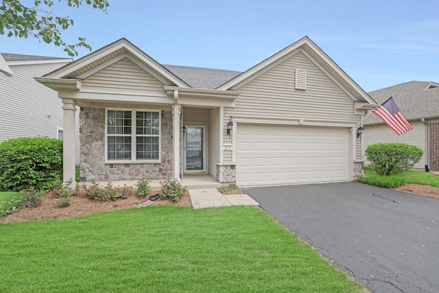 2628 Venetian Ln, Elgin, IL 60124 - single story home with driveway, stone siding, an attached garage, a front lawn, and roof with shingles