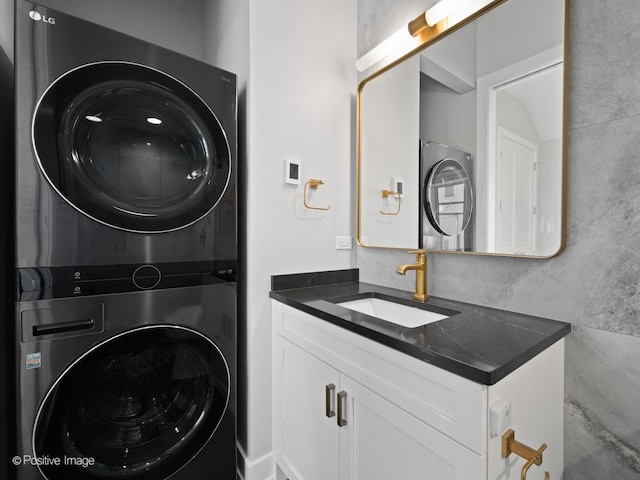 laundry area featuring estacked washer and dryer