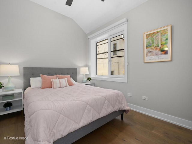 bedroom with lofted ceiling, wood finished floors, baseboards, and ceiling fan