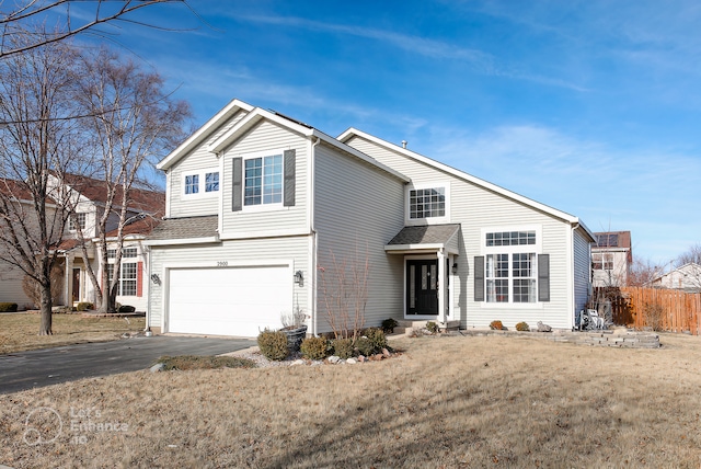 2900 Sierra Ave, Plainfield, IL 60586 - traditional-style home with fence, an attached garage, and driveway