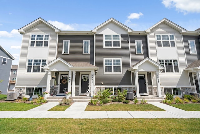 1447 Yosemite Way, Pingree Grove, IL 60140 - townhome / multi-family property with stone siding and central air condition unit