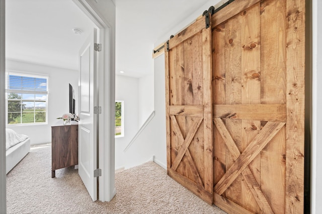 1447 Yosemite Way, Pingree Grove, IL 60140 - corridor with a barn door, carpet floors, and baseboards