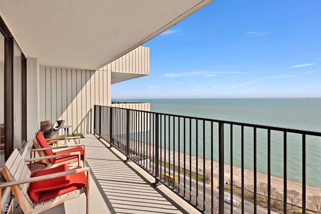balcony featuring a water view