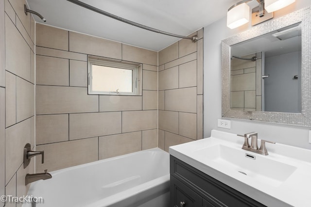 bathroom featuring washtub / shower combination and vanity